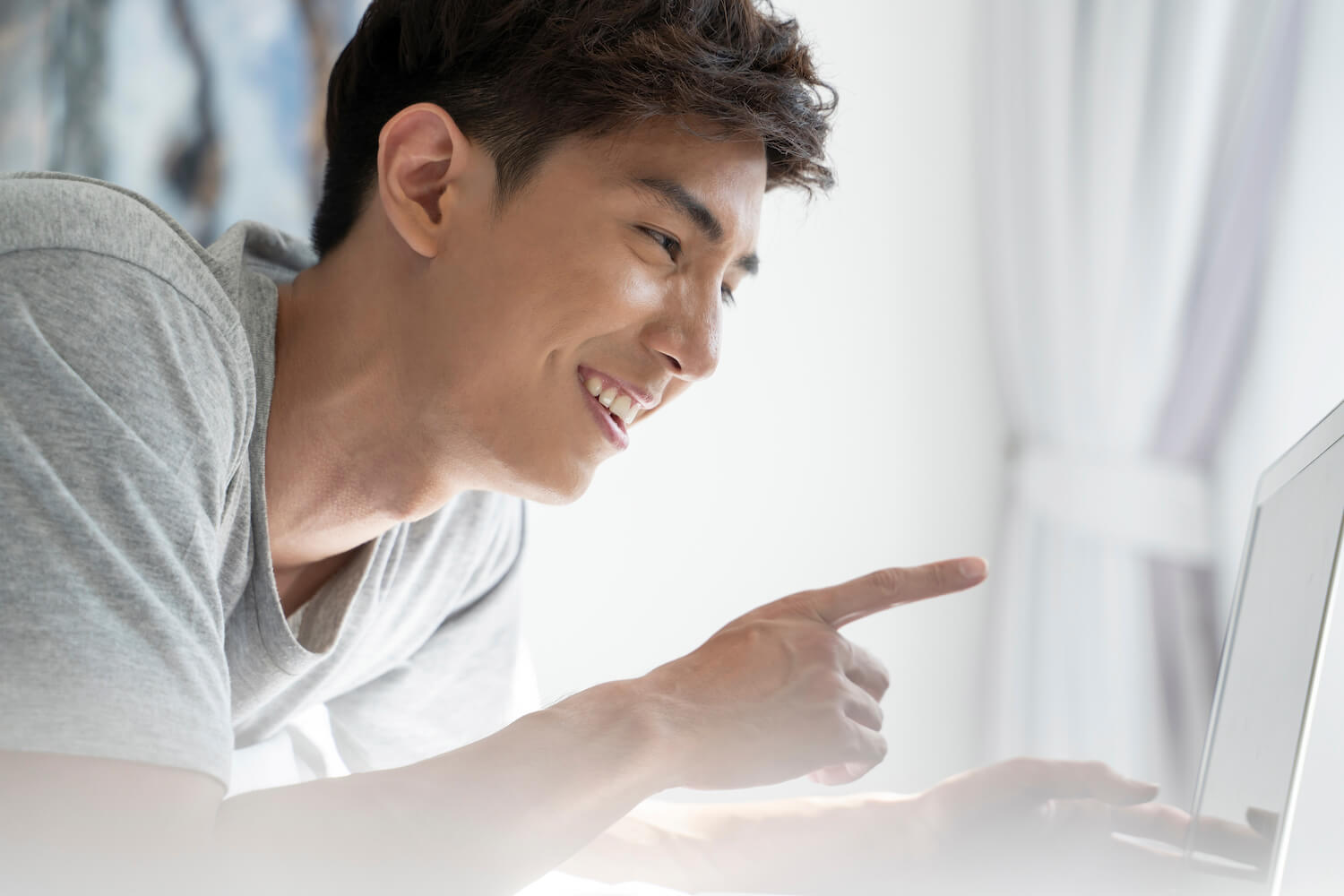 A man is having a good choice with his computer